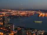 A ferry moves toward the city